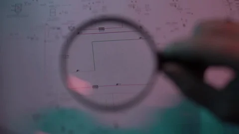 Documents under a magnifying glass Stock Footage