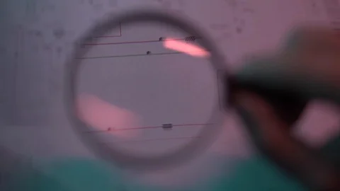 Documents under a magnifying glass Stock Footage 129105869