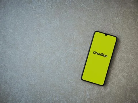 DocuSign app launch screen with logo on the display of a black mobile smartph Stock Photos