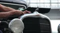 Dodge DR Special, 1934, repair man adding water, screws bolts HD Footage