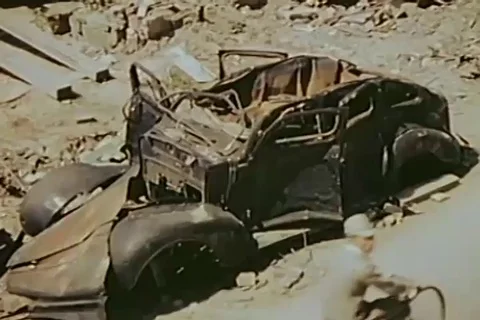 Dodge Sedan completely damaged by atomic blast - 1946 Stock Footage 103371847