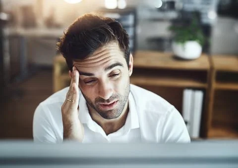 Doesnt look like Ill make this deadline in time. a young businessman looking Fotos Stock