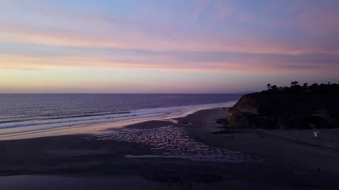 Dog Beach Low Tide Post-Sunset Aerial by Drone Helicopter with pastel sky Stock Footage 84088831