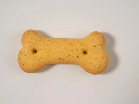 Dog biscuits on a white background. Stock Photos