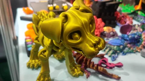 Dog skeleton head printed on a 3D printer from molten plastic close-up. Creative Stock Footage 303953159