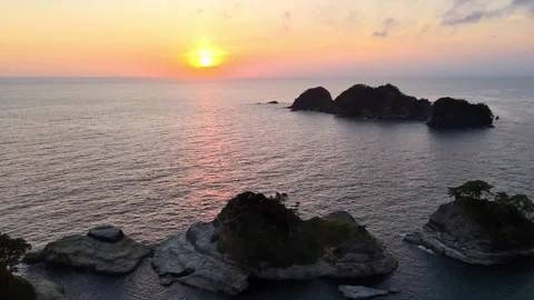 Dogashima Sunset Ocean Flying Forward Rock Gap 4K Stock Footage 326081820