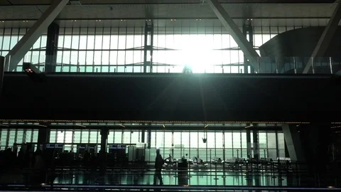 Doha Airport With Train Passing Over Passengers Sillhouette 動画素材 94425319