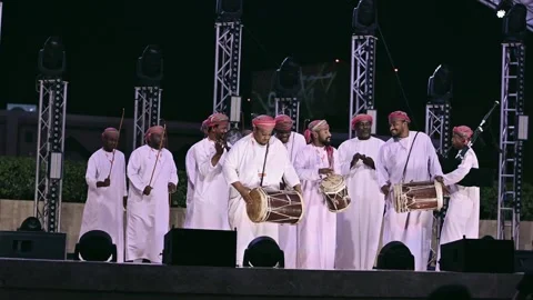 Doha, Qatar - 05 Jan, 2026: Arab men in white kandura performing traditional  Stock Footage 325561099