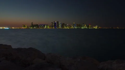 DOHA, QATAR - APRIL, 2023: Doha skyline timelapse video day to night lights Video stock 241913091