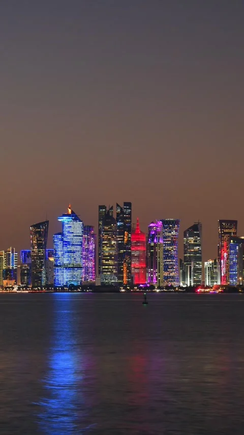 Doha, Qatar - january 8th, 2026: day to night timelapse Doha skyline at nig.. Stock Footage 331147826