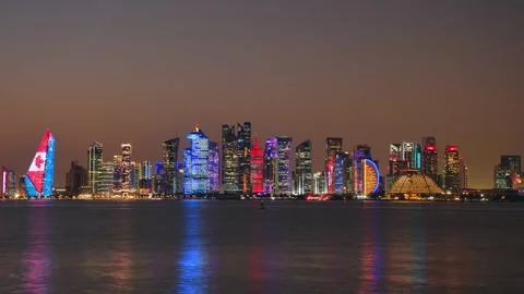 Doha, Qatar - january 8th, 2026: day to night timelapse Doha skyline at nig.. Stock Footage 331147871