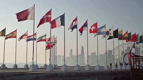 Doha, Qatar - Jun 20,2022: Flags with FIFA and Qatar 2022 World Cup logo wavi Stock Footage 199703832