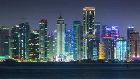 DOHA, QATAR - JUNE 30th 2017: skycreapers tall buildings timelapse night lights Stock Footage 238978915