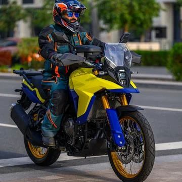 Doha - Qatar - March 17, 2024: A motorcycle driver riding a sports bike on an as Stock Photos