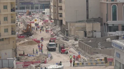 Doha, Qatar, migrant workers take a lunch break at road work site Stock Footage 49011347
