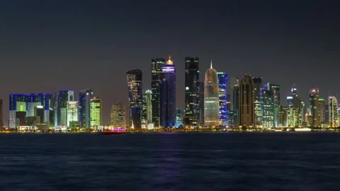 DOHA, QATAR - OCTOBER 25, 2024: Night skyline view of Doha with illuminated Stock Footage 289830875