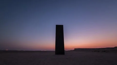 DOHA, QATAR - OCTOBER 25, 2024: A striking monolith stands against a vibrant Video stock 289835567