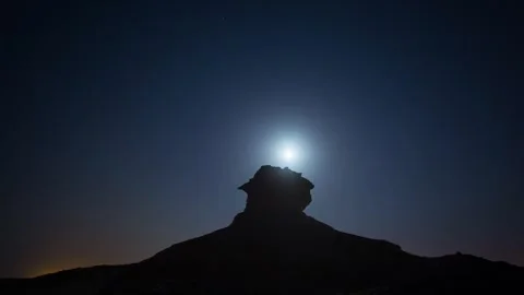 DOHA, QATAR - OCTOBER 25, 2024: Spectacular view of moonrise over dramatic rock Stock Footage 289835663