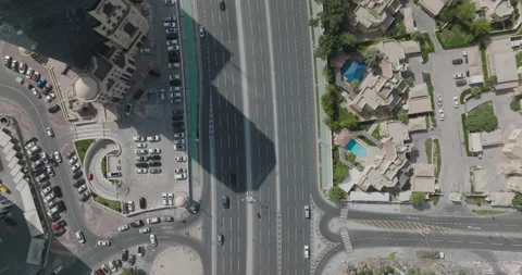 Doha, Qatar. Top down drone shot over some streets and cars passing by in Stock Footage 194713831