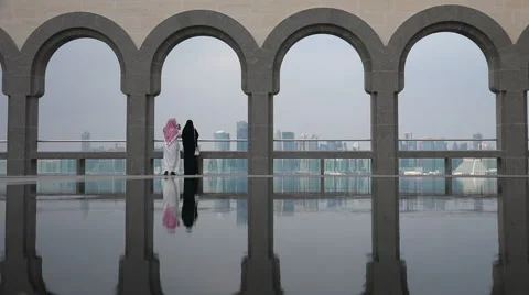 Doha skyline, Museum of Islamic Art, Arab couple take photos Stock Footage 49018367