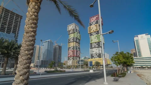 Doha skyline timelapse hyperlapse with colorful Al Marina Twin Towers building Video stock 85812528