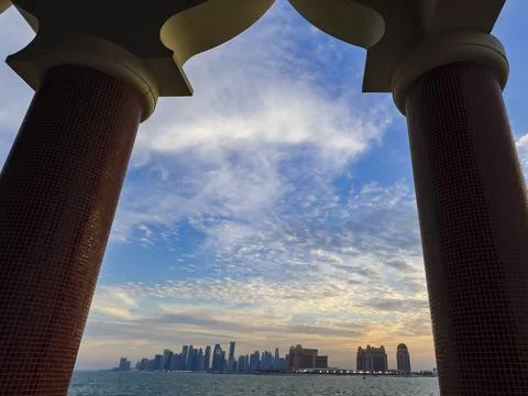 Doha Skyline View Framed by Katara Cultural Village Columns Stock Photos