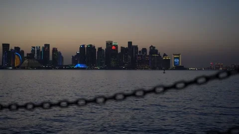 Doha West Bay skyline at sunset with blurred nautical chain Видео 342903742