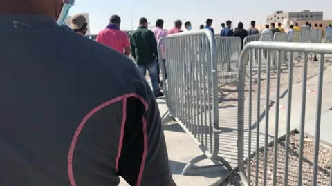 Doha,qatar-02/17/2022:People or public in Queue or in big line for vaccination Stock Footage 170480074