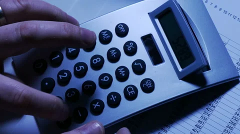 Doing accounts with calculator, overhead Stock Footage 61697392