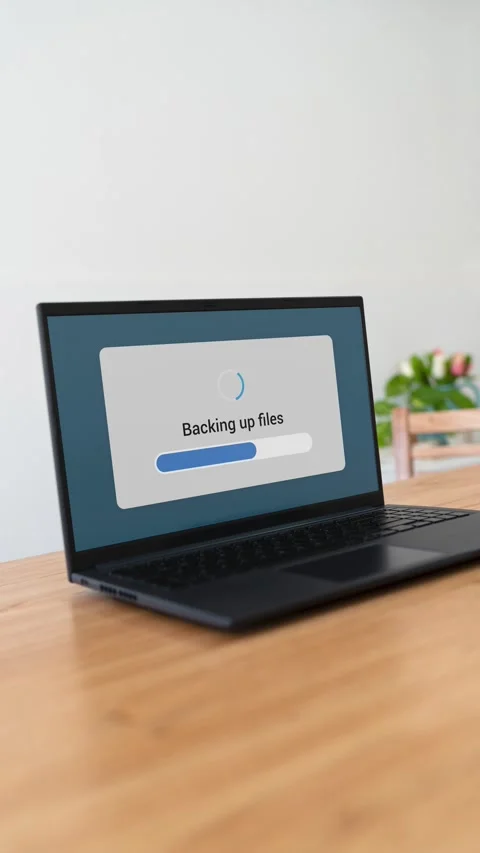 Doing backup of computer files on the cloud. Vertical shot. Stock Footage 310334521