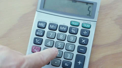 Doing calculations on an electronic calculator Stock Footage 304082853