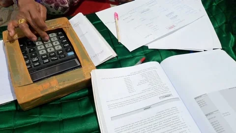 Doing calculations for financial reports. Stock Footage 239533569