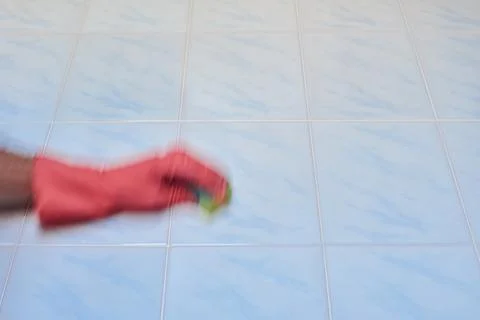 Doing cleaning in bathroom Stock Photos