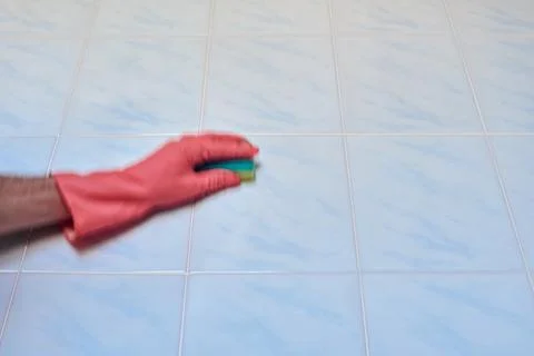 Doing cleaning in bathroom Stock Photos