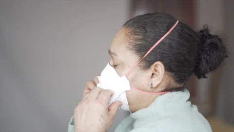 Doing Coronavirus Test from Nouse to an Old Woman . Stock Footage 128006496