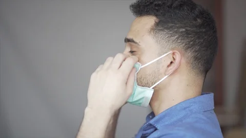 Doing Coronavirus Test to an Young Man from the Saliva. Stock Footage 128006502