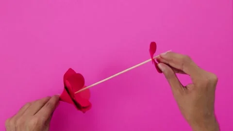 Doing crafts. Red paper flower Stock Footage 168727213