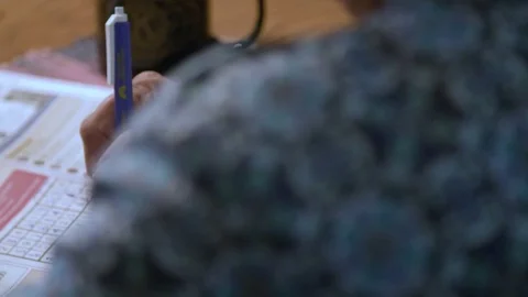 Doing a Crossword Puzzle Stock Footage 81607210