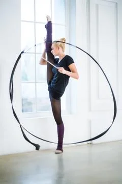 Doing exercises with a ribbon Foto stock