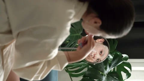 Doing face massage with jade roller at home Stock Footage 196657497