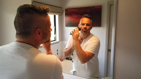 Doing the final touches of the morning shave and looking sweet for the day Stock Footage 121870593