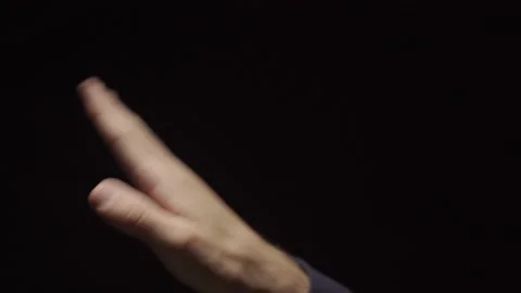 Doing hand wave gesture or funky dance move with hand - black background Stock Footage 132259184