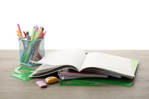 Doing homework. Copybook with math assignment and different stationery on w.. Stock Photos