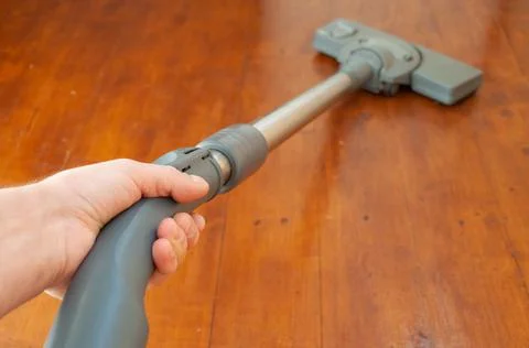 Doing the housework with the vacuum cleaner Stock Photos