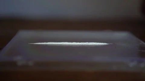 Doing a line of Cocaine- Slow Motion Stock Footage 81944924