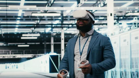 Doing machines maintenance, VR glasses equipment and employee in server hub Stock Footage 330089677