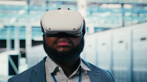Doing machines maintenance, VR glasses equipment and employee in server hub Stock Footage 330139486