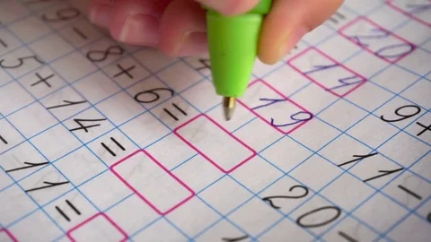 Doing math homework. Solves simple examples Stock-Footage 75435974