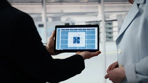 Doing microchips yield enhancement, tablet and senior manager with worker Stock Footage 335882527