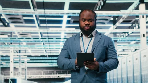 Doing network management, laptop and software developer in server farm. Stock Footage 330030293